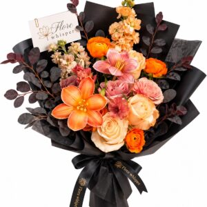 Sunset Romance orange and blush mixed flower bouquet in black wrapping on a white background